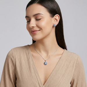 Woman Wearing Blue Zaria Radiant Circle Pendant Set